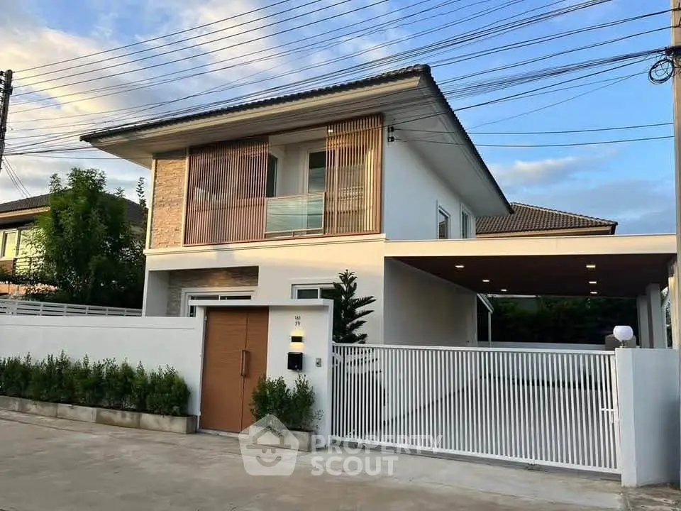 Modern two-story house with sleek design and spacious driveway