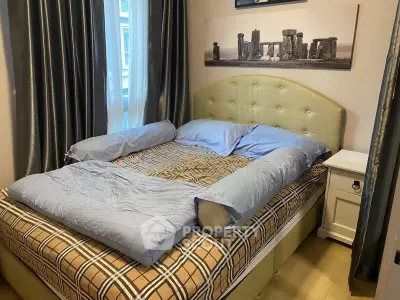 Cozy bedroom with stylish decor and comfortable bed in modern apartment.