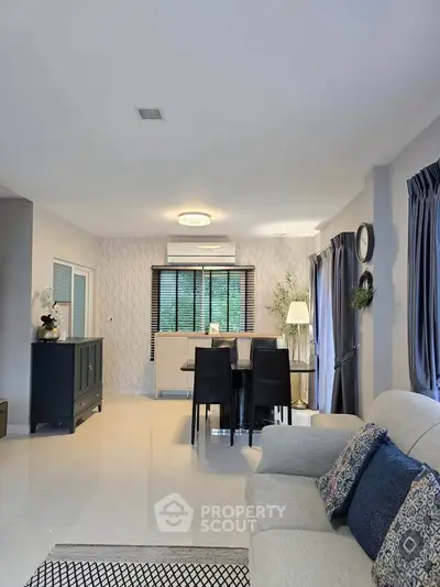 Modern living room with elegant dining area and stylish decor