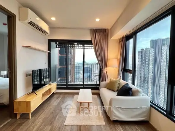 Modern living room with panoramic city view and stylish furnishings.