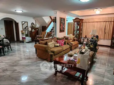 Spacious living room with elegant furniture and marble flooring