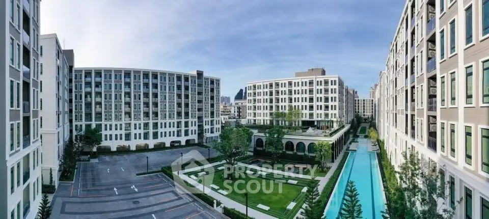 Luxurious modern apartment complex with pool and garden view