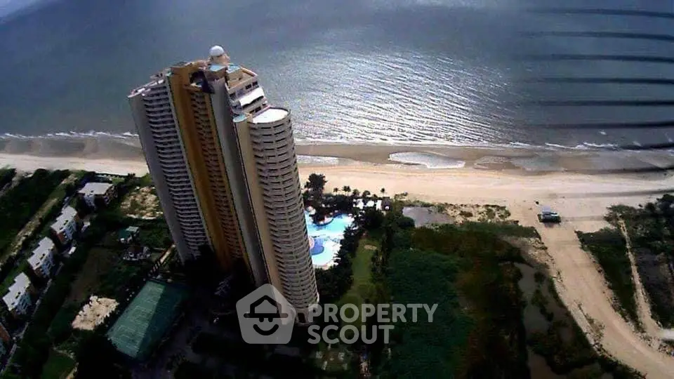 Stunning beachfront high-rise with panoramic ocean views and luxurious amenities.