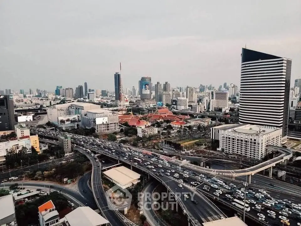Stunning cityscape view showcasing modern skyscrapers and bustling highways, perfect for urban living enthusiasts.