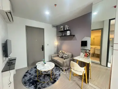 Modern living room with stylish decor and cozy seating area in a contemporary apartment.