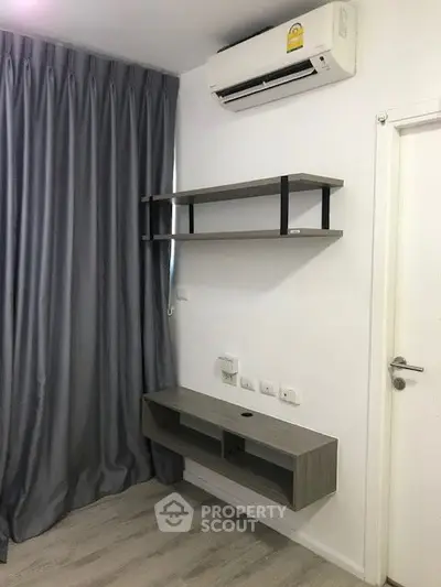 Modern room with air conditioning and sleek shelving unit