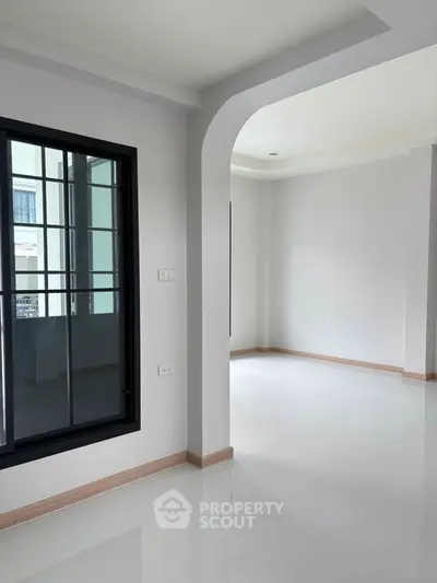 Spacious modern interior with large windows and sleek design, perfect for customization.