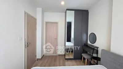 Modern bedroom with sleek wardrobe and minimalist decor