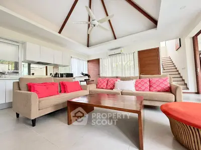 Spacious living room with vaulted ceiling and modern decor in a stylish home
