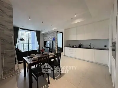 Modern open-layout kitchen and dining area with city view, sleek cabinetry, and elegant dining setup.