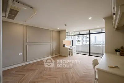 Spacious living room with modern design and balcony view
