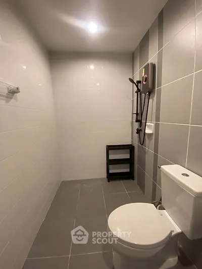 Modern bathroom with sleek gray tiles and contemporary fixtures