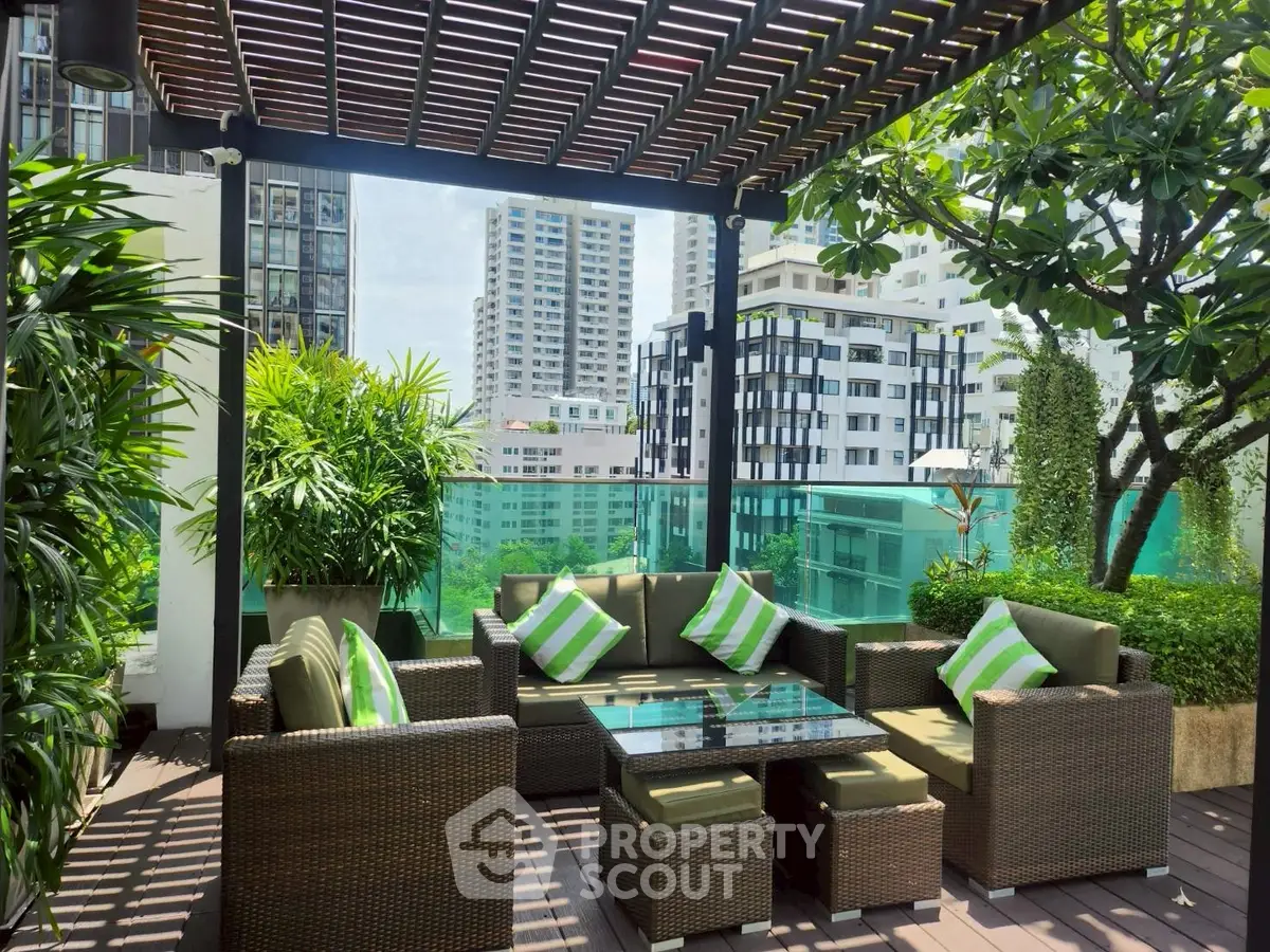 Luxurious rooftop terrace with modern seating and stunning city views