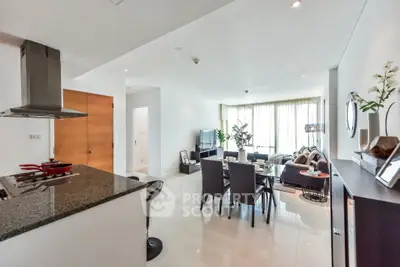 Spacious modern living room with open kitchen and elegant decor