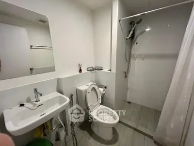 Modern bathroom with sleek fixtures and walk-in shower in contemporary apartment