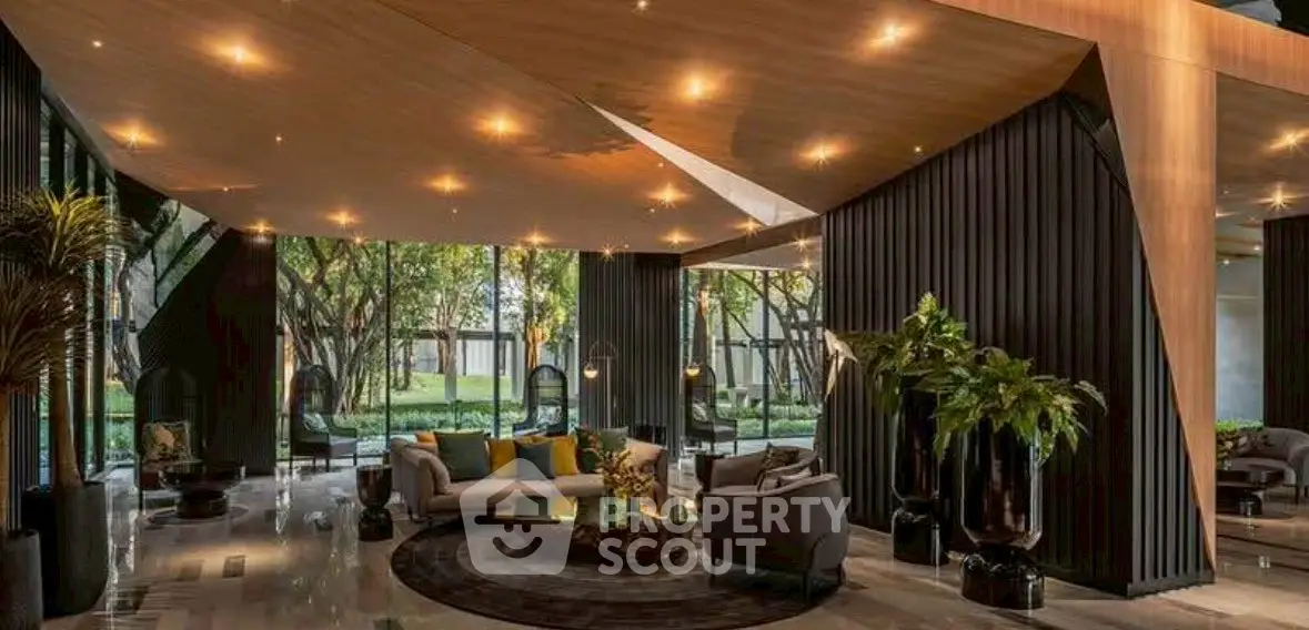 Luxurious modern living room with elegant decor and large windows overlooking a lush garden.
