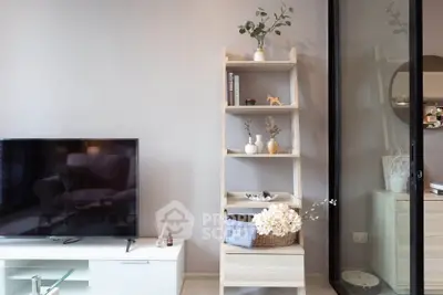 Modern living room with stylish shelving and TV unit, perfect for cozy relaxation.