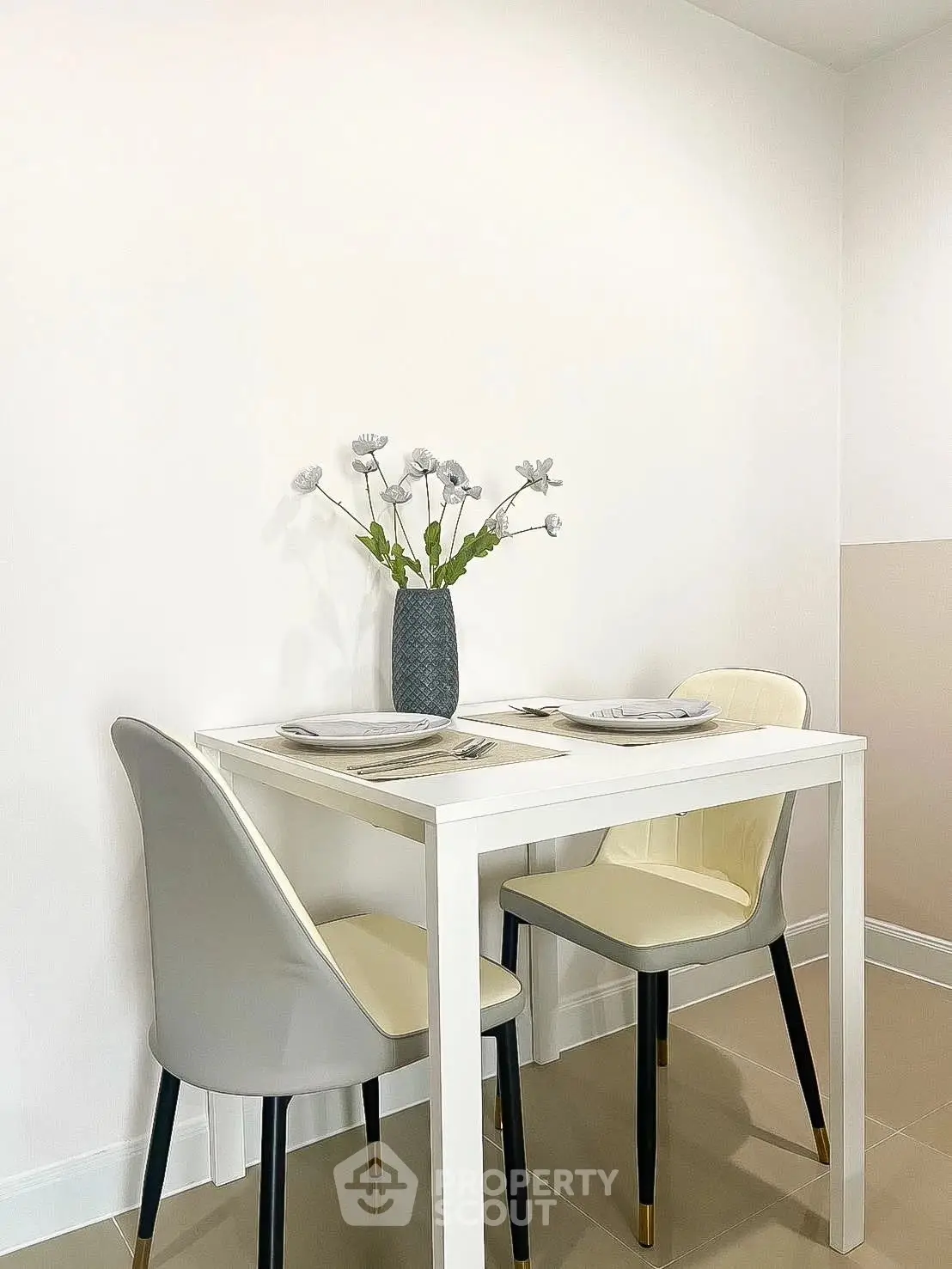 Chic dining nook with modern table and chairs, perfect for cozy meals in a stylish apartment.