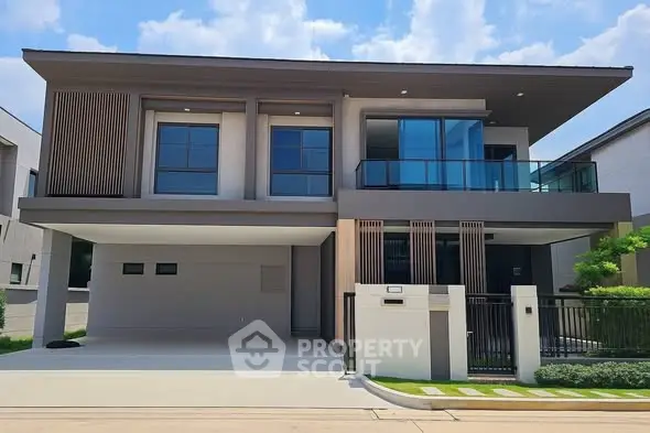 Modern two-story house with sleek design and spacious balcony