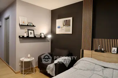Modern bedroom with stylish decor and cozy seating area