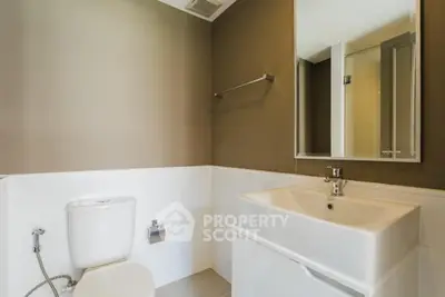Modern bathroom with sleek fixtures and neutral tones