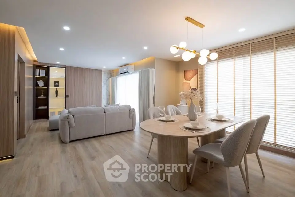 Spacious modern living room with elegant dining area and natural light