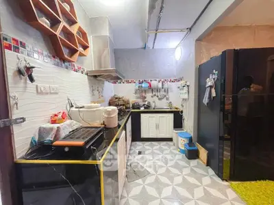 Charming kitchen with modern appliances and unique tile flooring