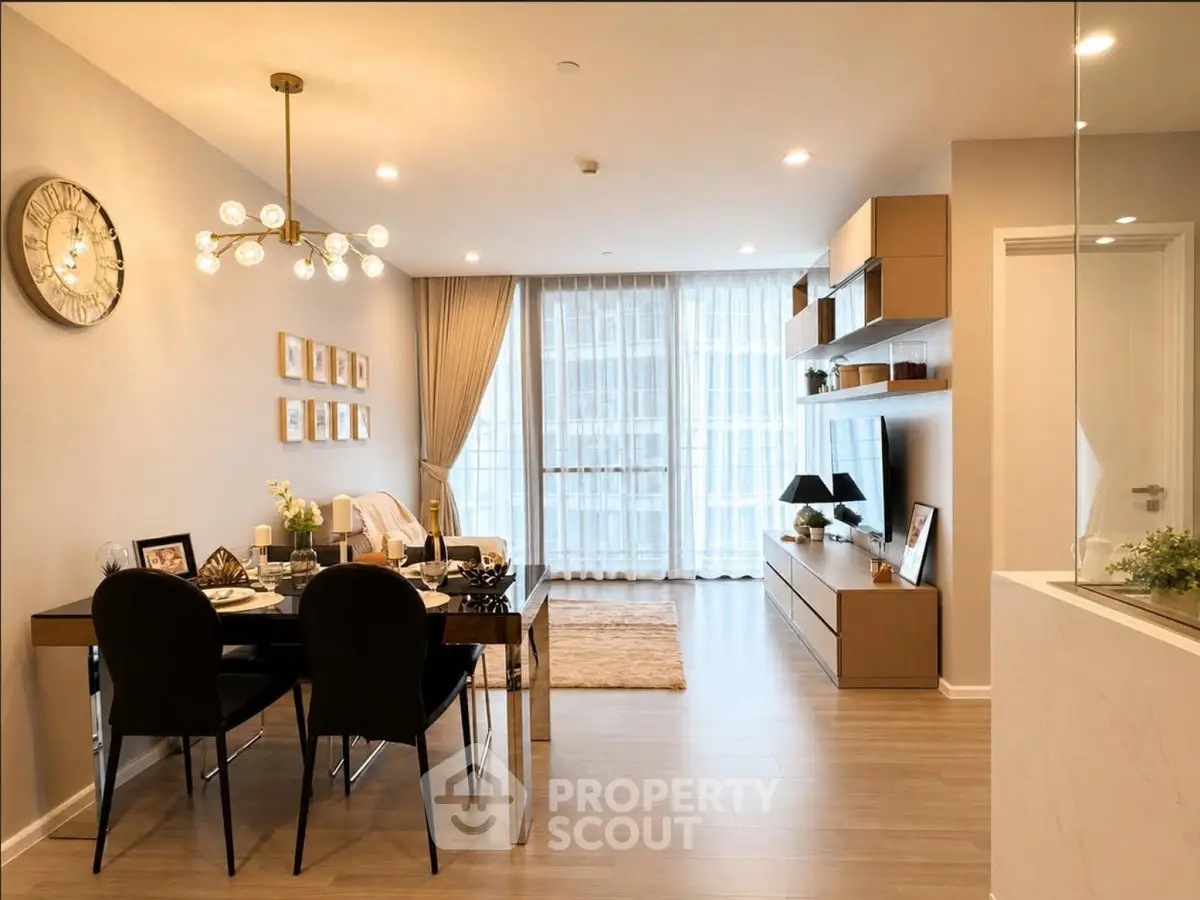 Modern living room with elegant dining area and stylish decor in a contemporary apartment.