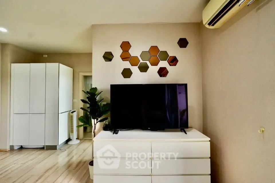 Modern living room with stylish decor and air conditioning unit