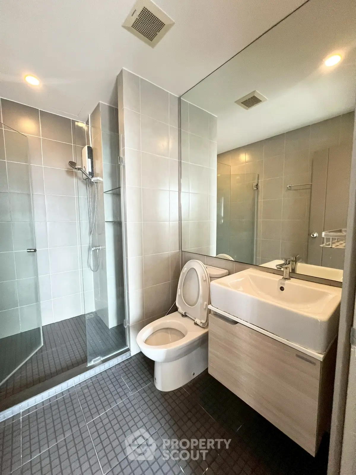 Modern bathroom with glass shower and sleek fixtures