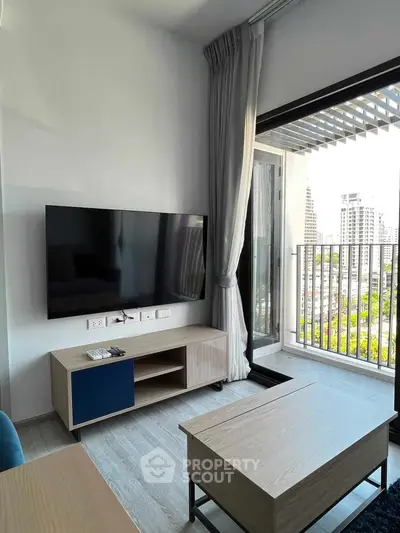 Modern living room with balcony view in urban apartment