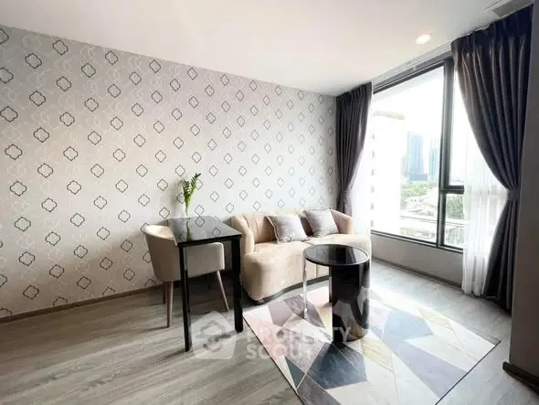 Modern living room with stylish decor and large window view