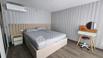 Modern bedroom with stylish decor and comfortable bed in a contemporary apartment.