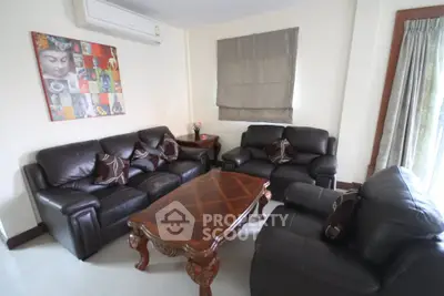 Cozy living room with leather sofas and elegant wooden coffee table