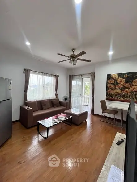 Spacious living room with modern furniture and natural light