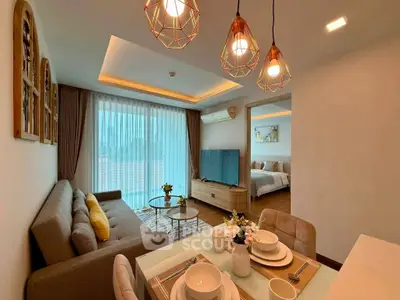 Modern living room with stylish lighting and open view to bedroom, perfect for cozy urban living.