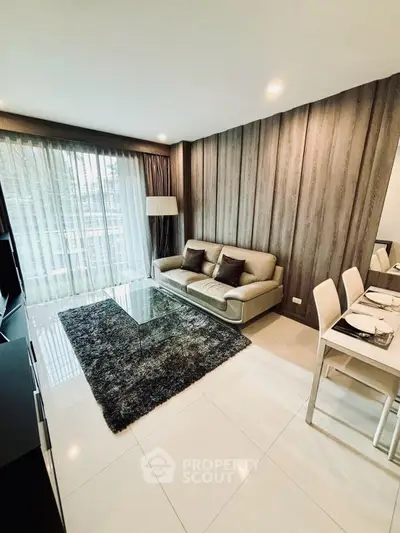 Modern living room with stylish decor and large window for natural light