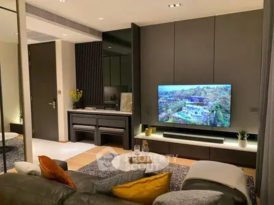Modern living room with stylish decor and wall-mounted TV