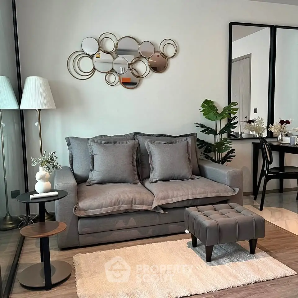 Stylish modern living room with elegant decor and cozy seating area.