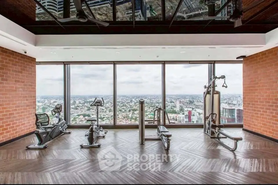 Luxury gym with panoramic city view and modern equipment