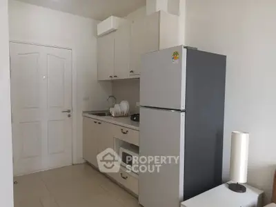 Compact kitchen with modern appliances and sleek cabinetry