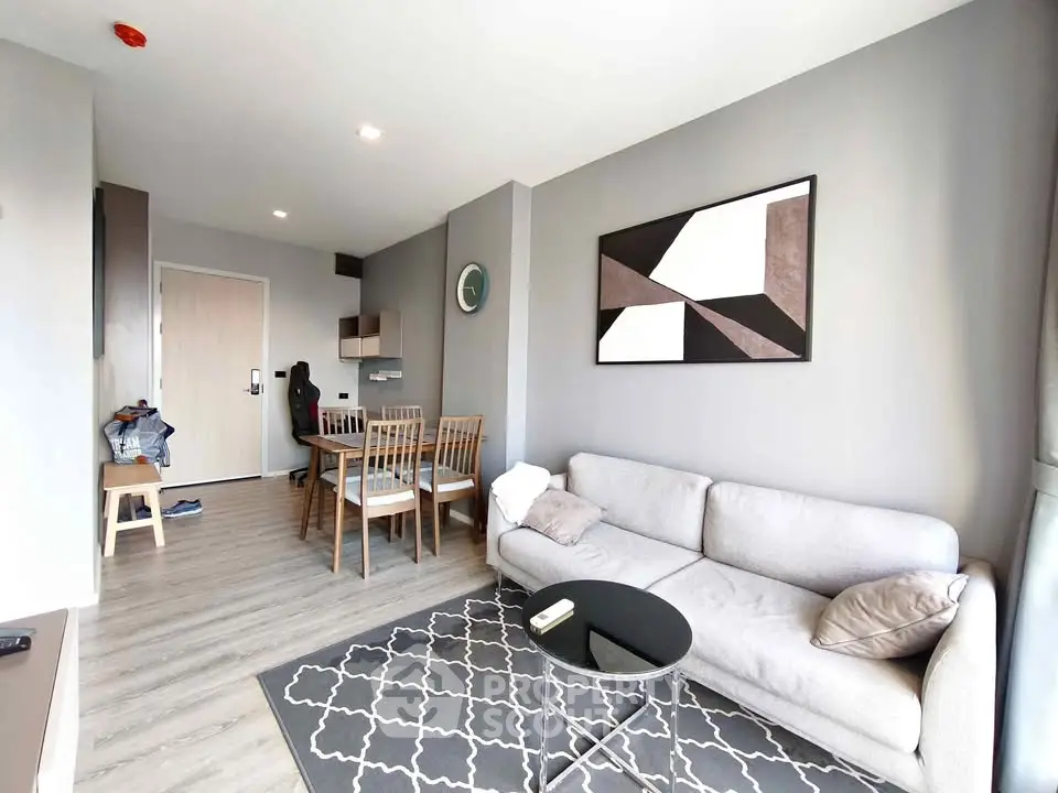 Modern living room with stylish decor and cozy seating area in a contemporary apartment.