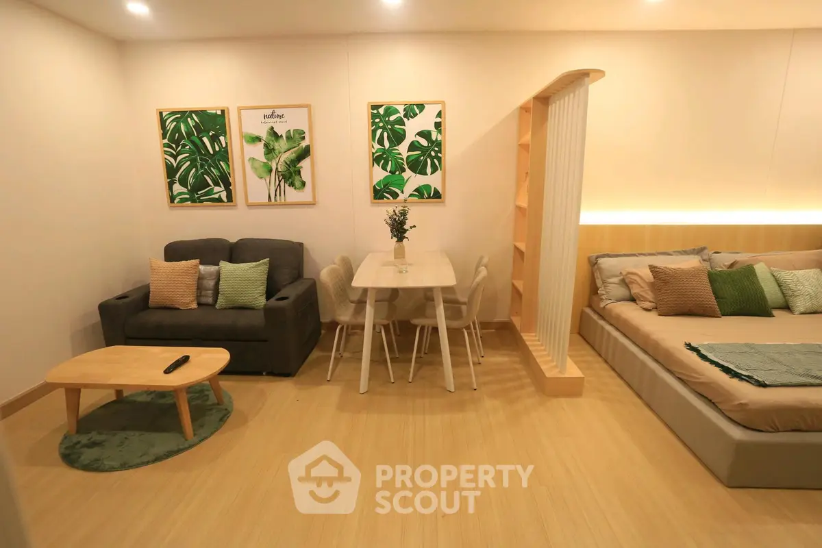 Modern studio apartment with cozy living area and stylish decor