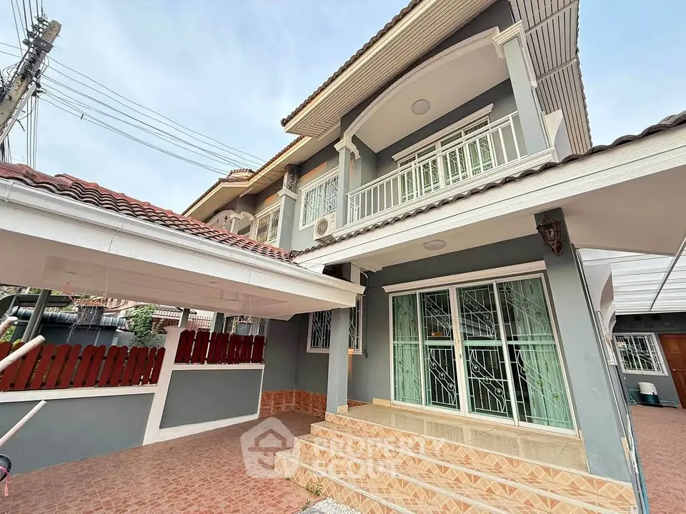 Charming two-story house with spacious carport and elegant exterior design.