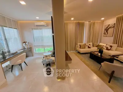 Luxurious modern living room with elegant decor and ample natural light