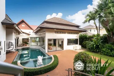 Luxurious villa with private pool and lush garden in tropical setting