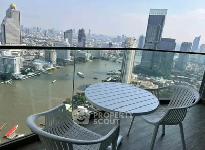 Stunning high-rise balcony with breathtaking city and river views, perfect for urban living.