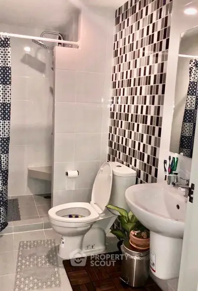 Modern bathroom with stylish tile design and sleek fixtures