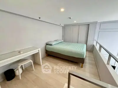 Modern minimalist bedroom with sleek design and ample natural light