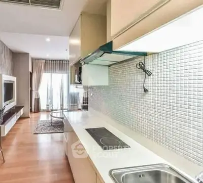 Modern kitchen with sleek design and open layout in a stylish apartment.